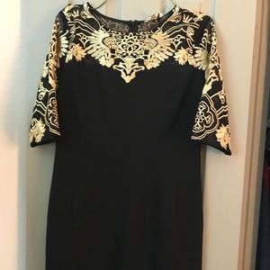 Brand new Black cocktail Dress with Gold detail.